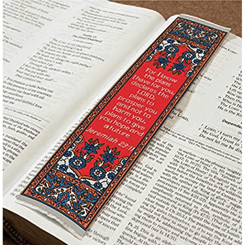 woven tapestry-style bookmark placed on a bible