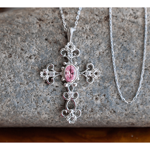 This stunning Antique Pink Tourmaline October Birthstone Cross Pendant merges the old with the new in a modern take on antique styling.
