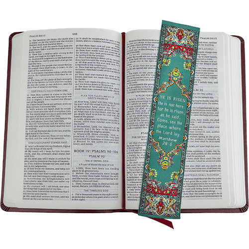 woven tapestry-style bookmark placed on a bible