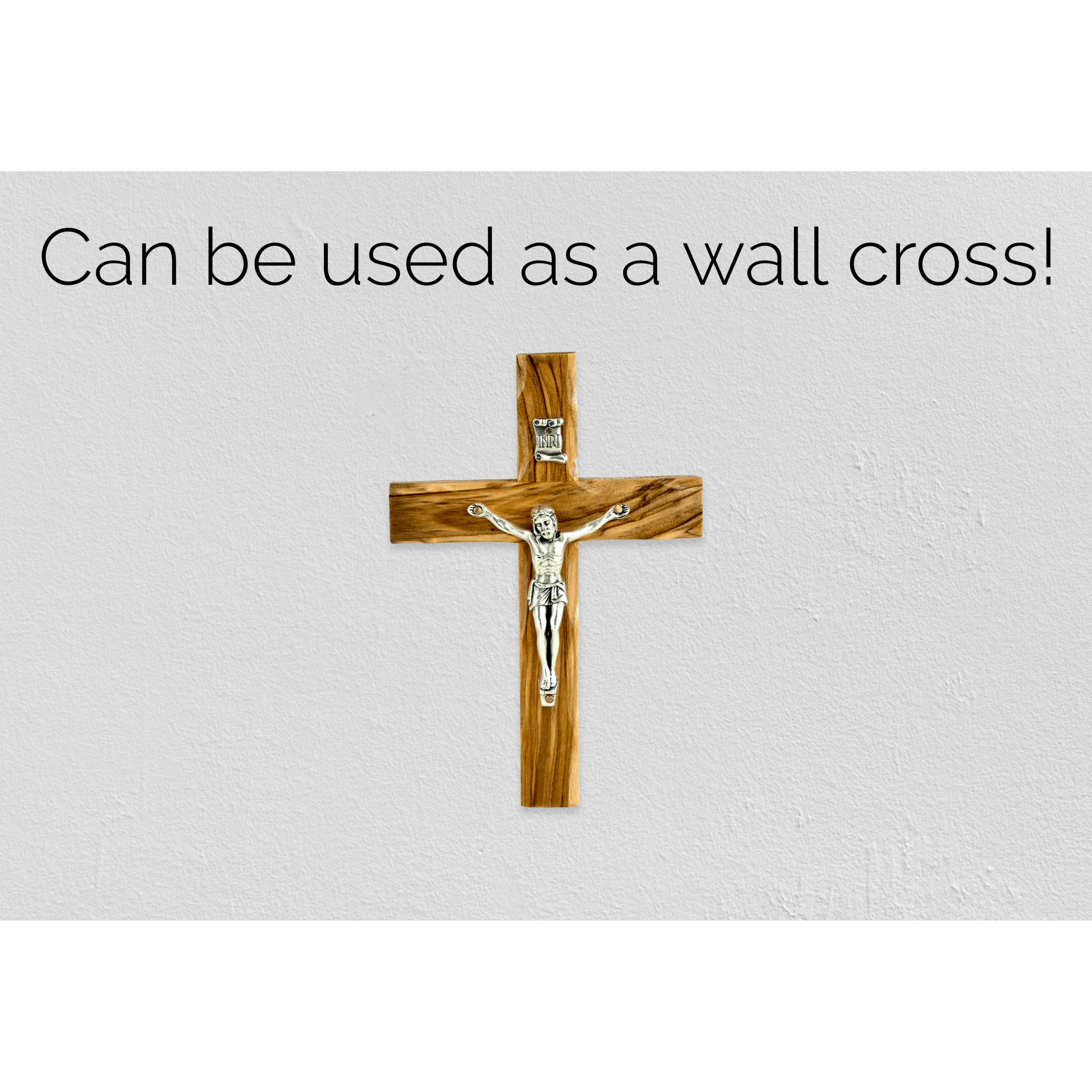 crucifix cross and inri plaque hanging on a wall using the hanging hall
