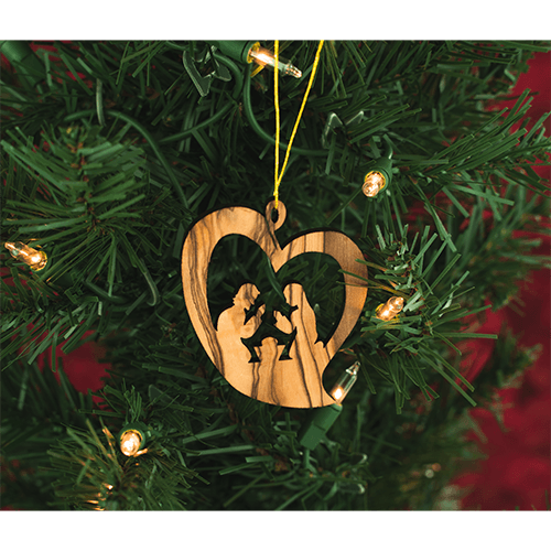 holy land heart nativity holiday ornament hanging on a christmas tree