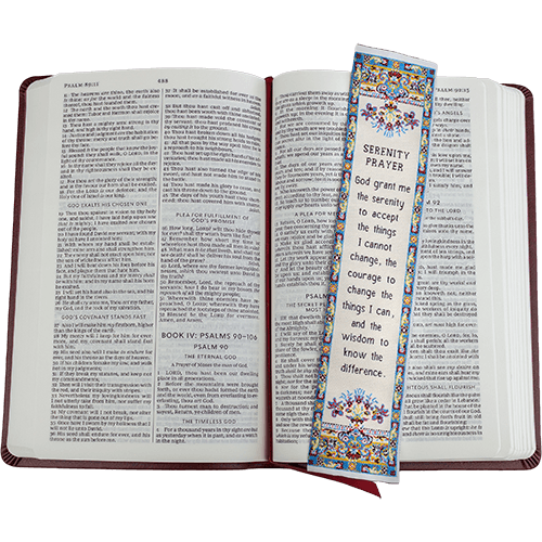 woven tapestry-style bookmark placed on a bible