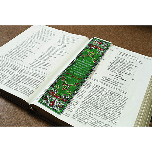 woven tapestry-style bookmark placed on a bible