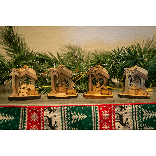 Holy Land 4 Ornament Olive Wood Nativity Set in Box  on a mantle