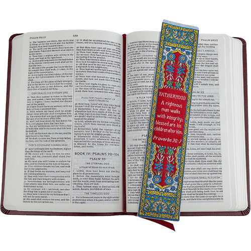 woven tapestry-style bookmark placed on a bible