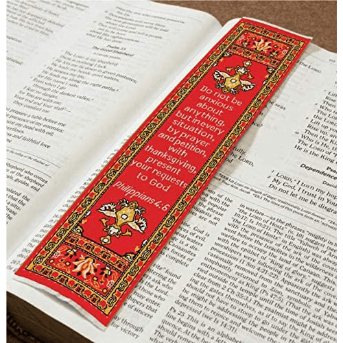 woven tapestry-style bookmark placed on a bible