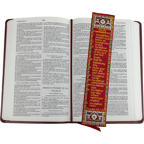 woven tapestry-style bookmark placed on a bible