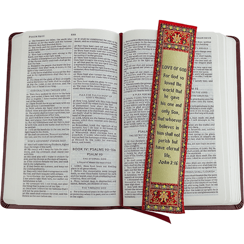 woven tapestry-style bookmark placed on a bible