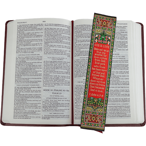 woven tapestry-style bookmark placed on a bible