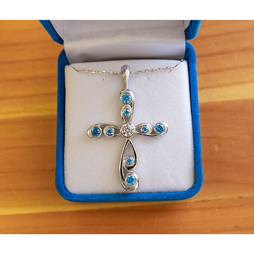 This Antique Blue Topaz December Birthstone Cross Pendant comes with an 18" sterling silver chain with a spring-ring clasp and is packaged in a luxurious plush velvet box.