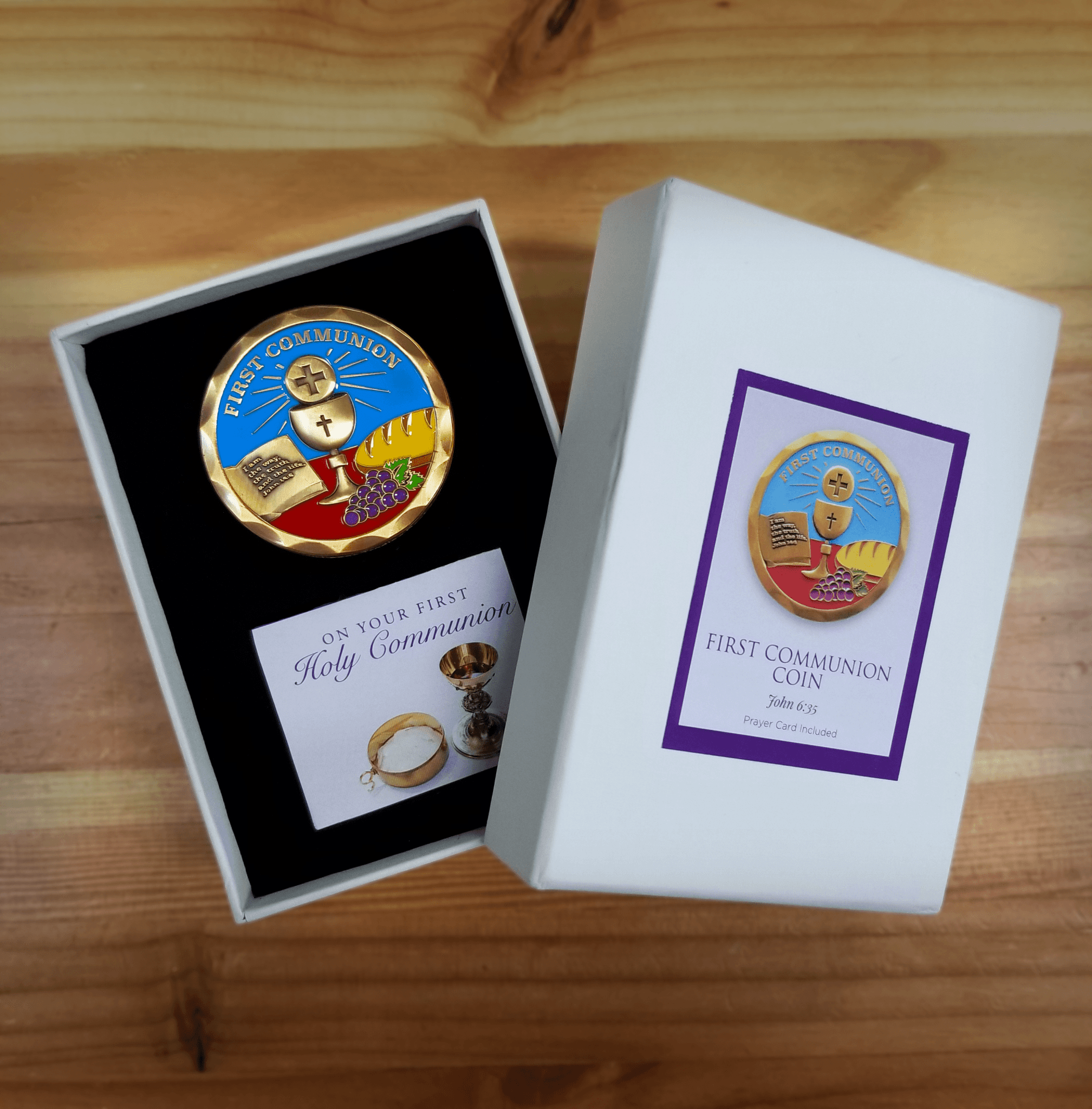 First Communion Gold Plated Christian Challenge Coin and scripture card in coin box on a wooden table