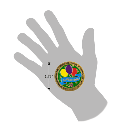 Picture showing the 1.75" size of the happy birthday coin, with silhouette of a human hand for reference