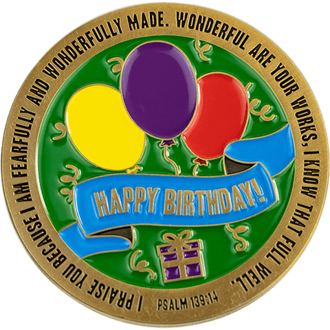 Front of happy birthday challenge coin, with balloons and confetti