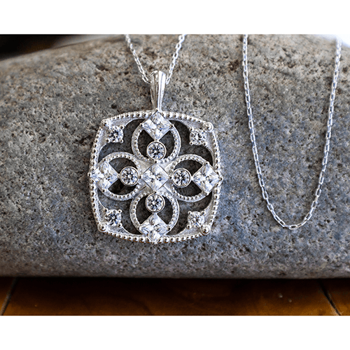 April Cubic Zirconia Antique Birthstone Cross Pendant - with 18" Sterling Silver Chain on stone