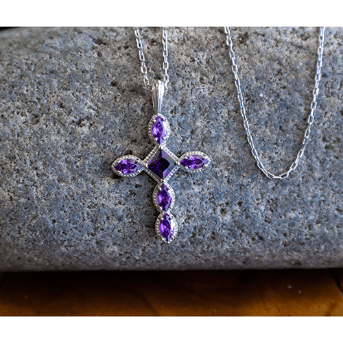 February Amethyst Antique Birthstone Cross Pendant - With 18" Sterling Silver Chain on a stone
