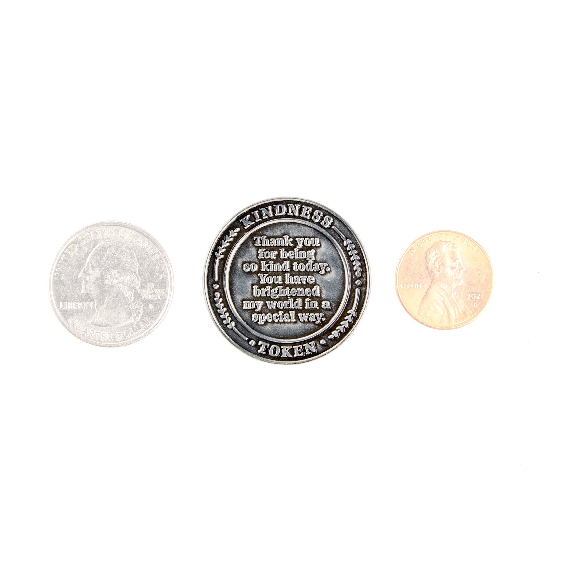 Kindness Token with other coins to show size