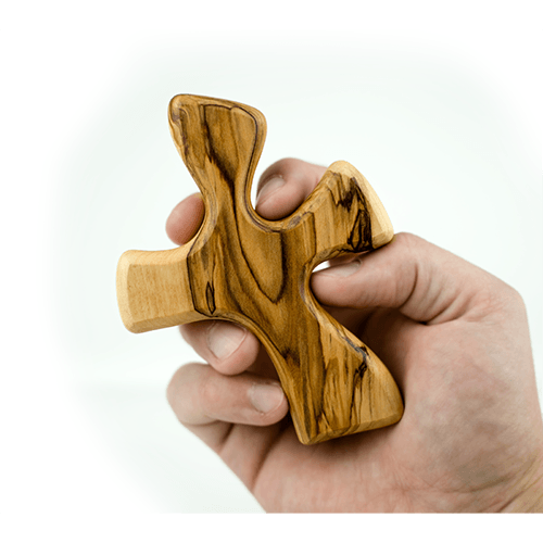 Clinging Healing Comfort Cross, Large, Certified Olive Wood from Israel in hand