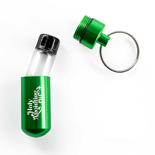 Oil Vial Keyring showing open keyring vial holder with vial inside
